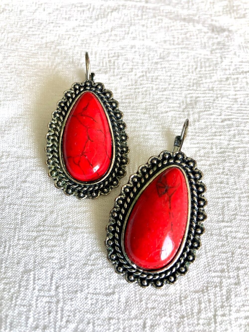 Red Tear Drop Earrings Set in Silver Toned Border